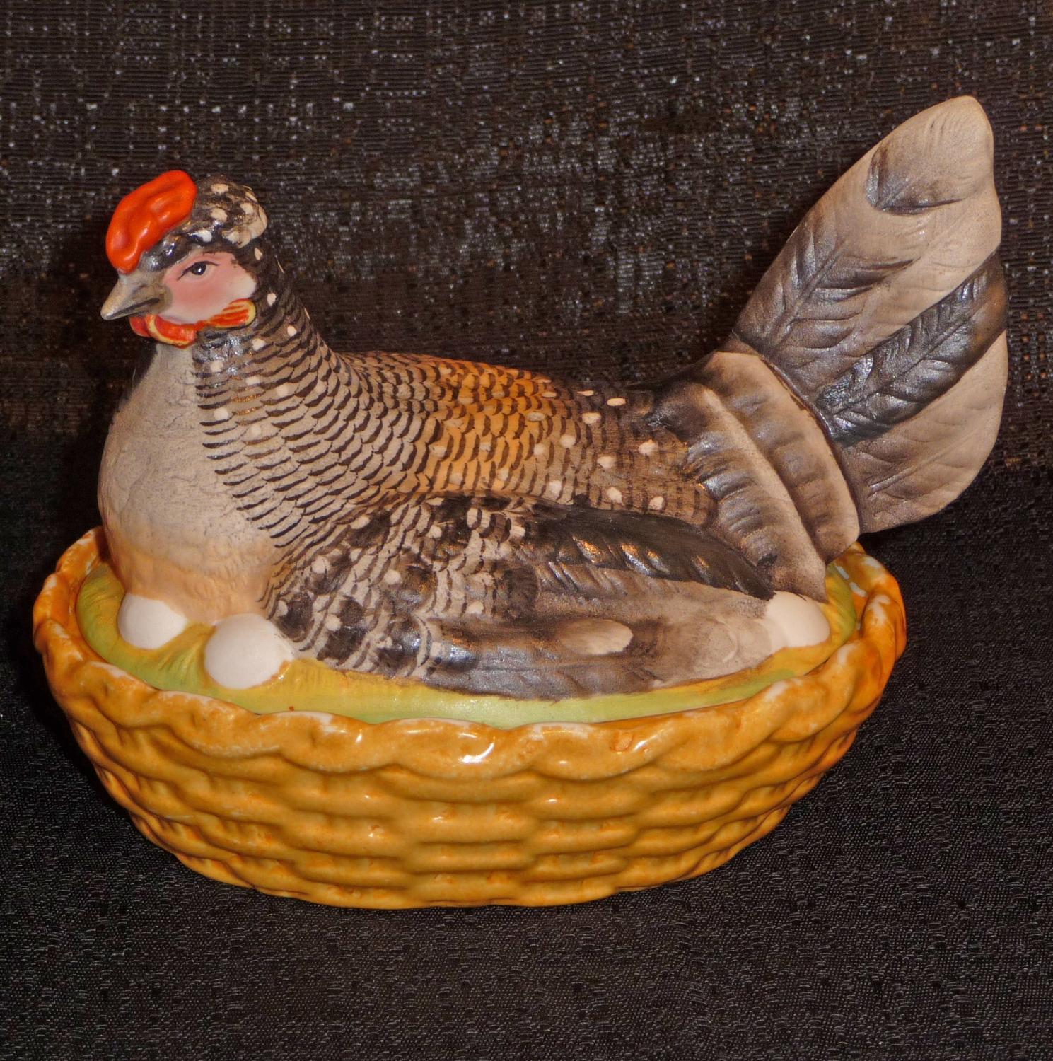 Small French bisque hen on nest