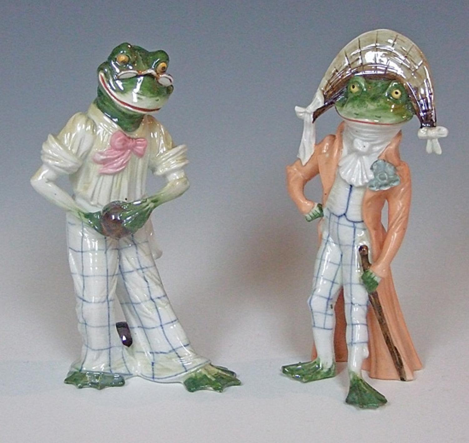 A whimsical pair of porcelain frog figures