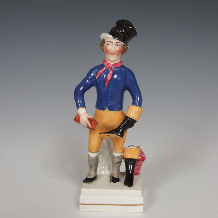 Early Staffordshire 'Bootblack' figure