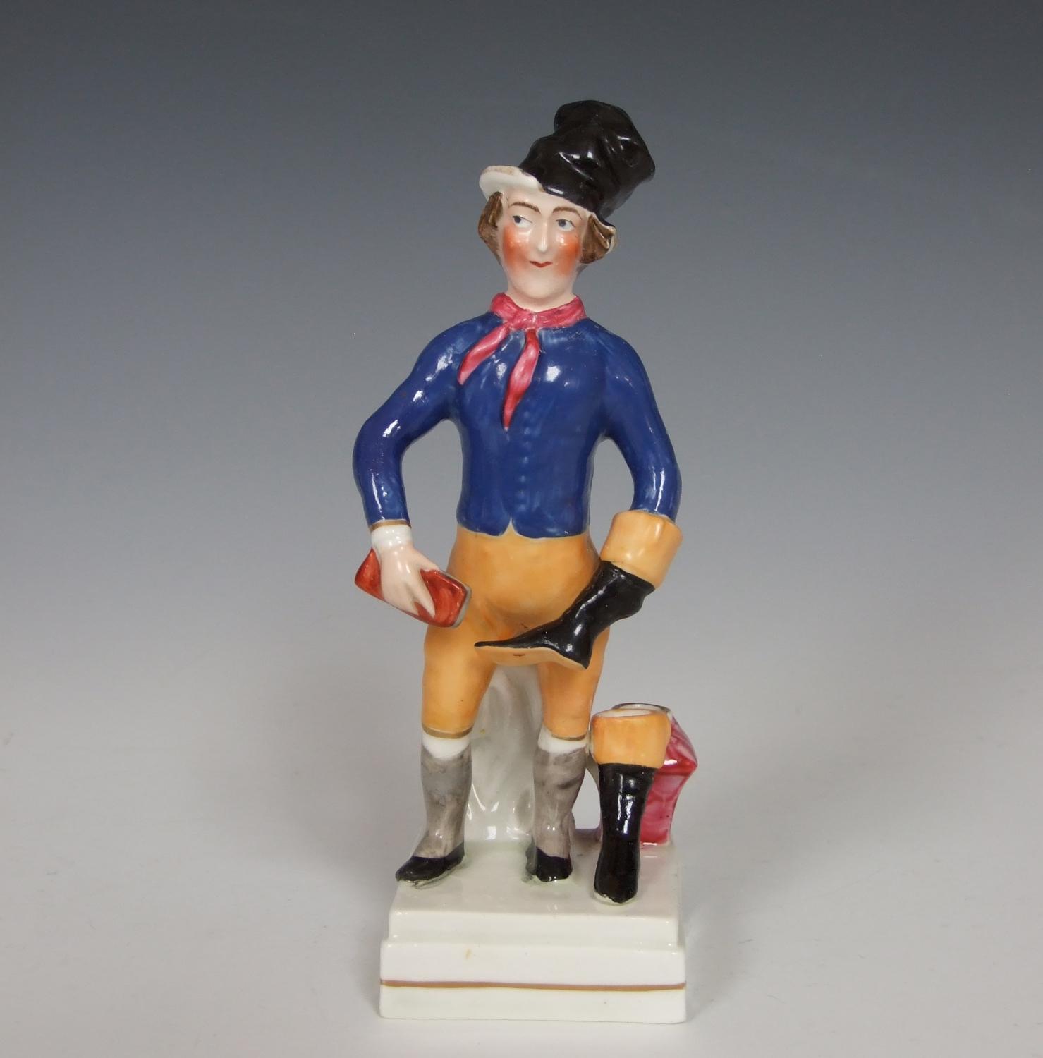 Early Staffordshire 'Bootblack' figure
