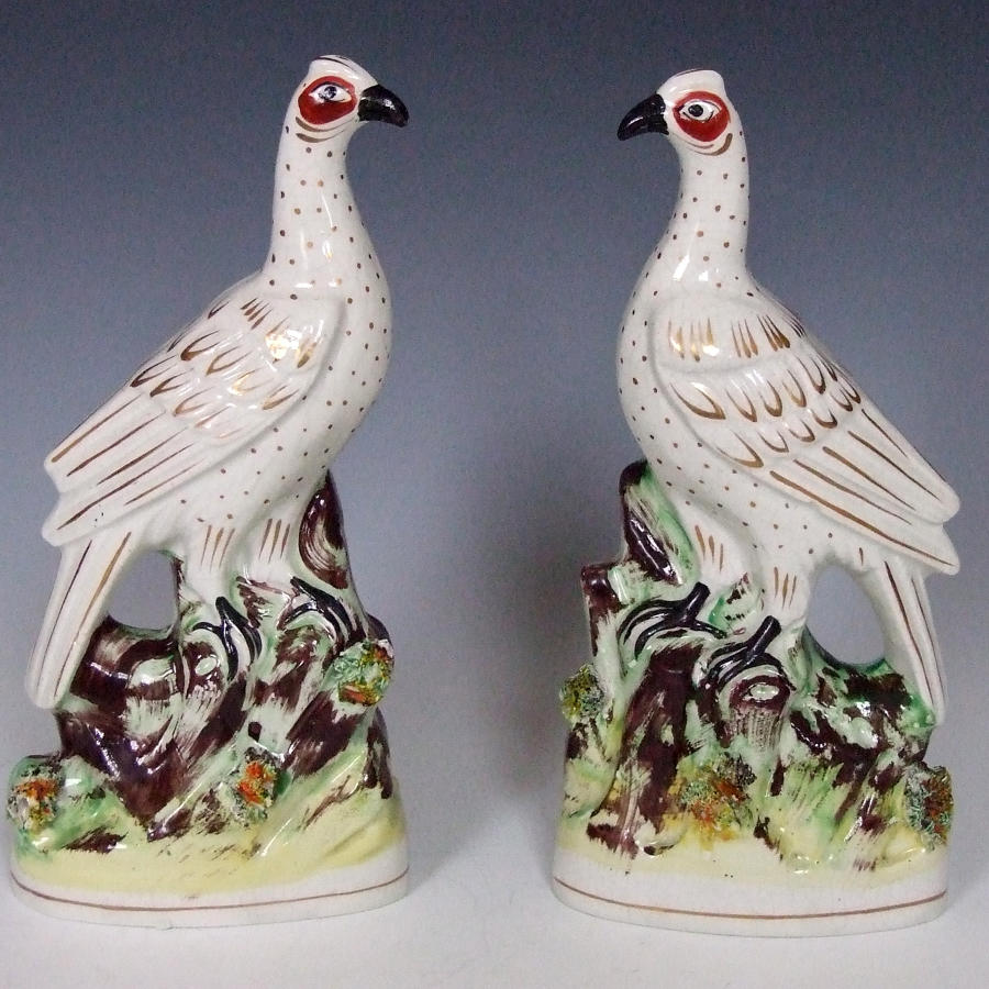 Fine pair of gilt and white Staffordshire bird figures.