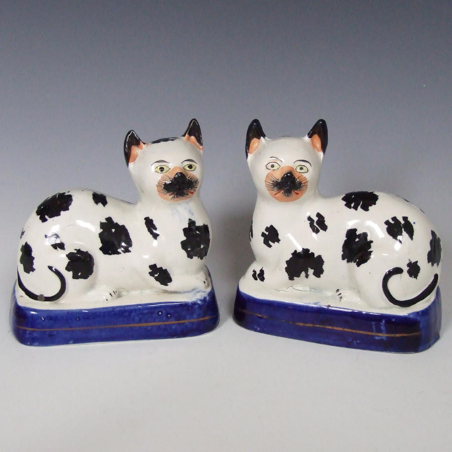 Extremely rare pair of Staffordshire cat figures