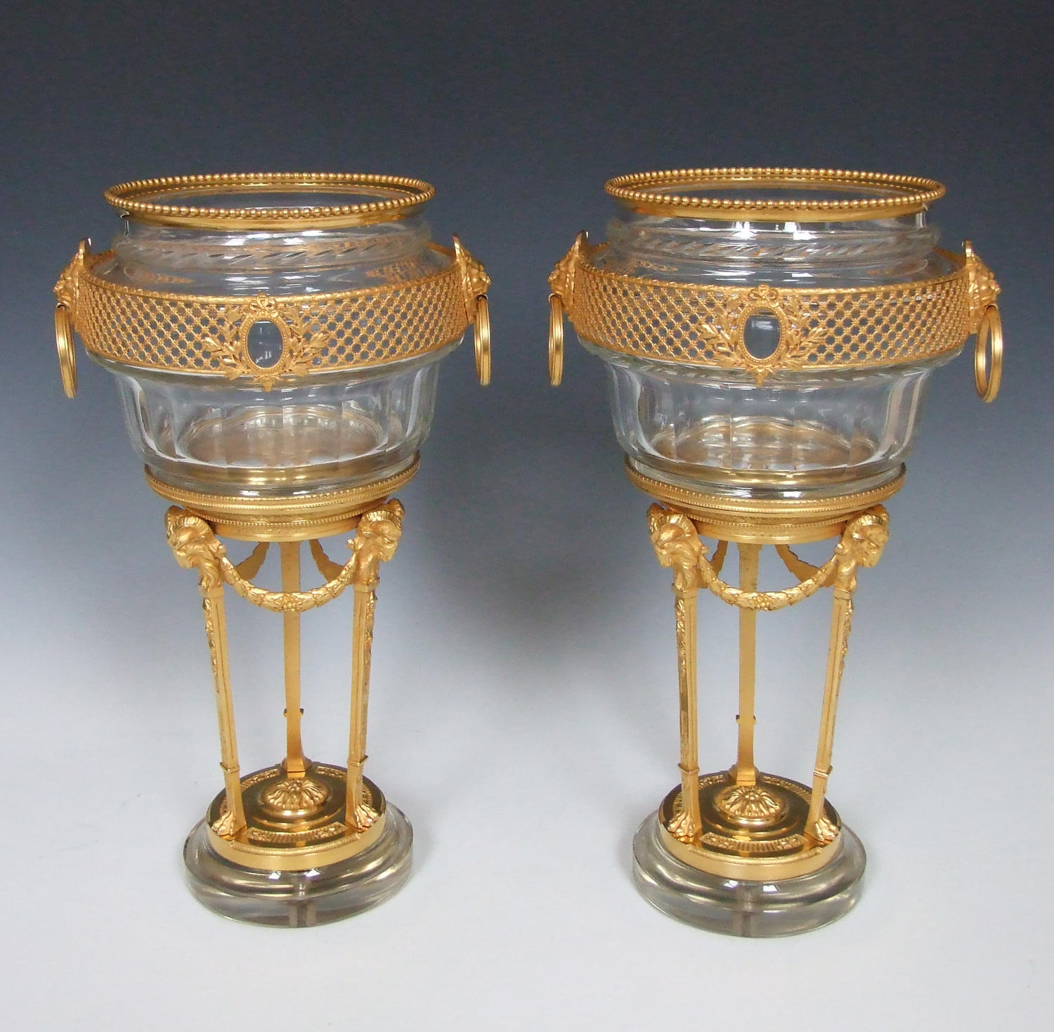 Exceptional pair of crystal glass cachepots on stands