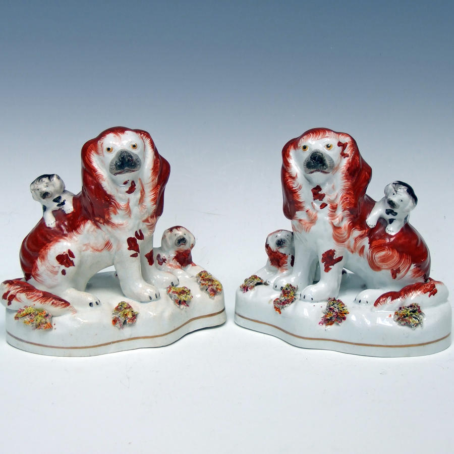 Charming pair of early Staffordshire spaniel and pup figures