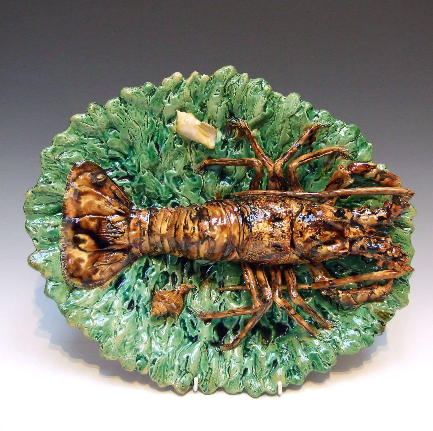 A fabulous Palissy rock lobster motif oval charger by Alfred Renoleau