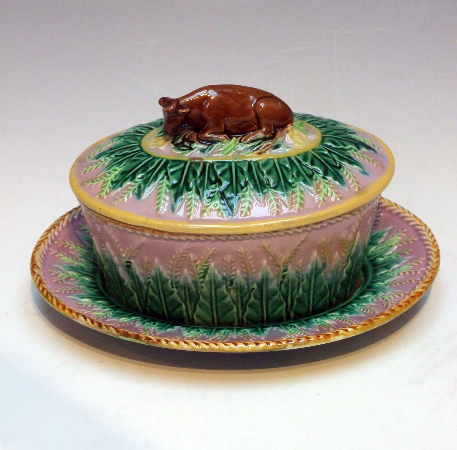 Rare George Jones majolica lilac ground cow finial butter dish