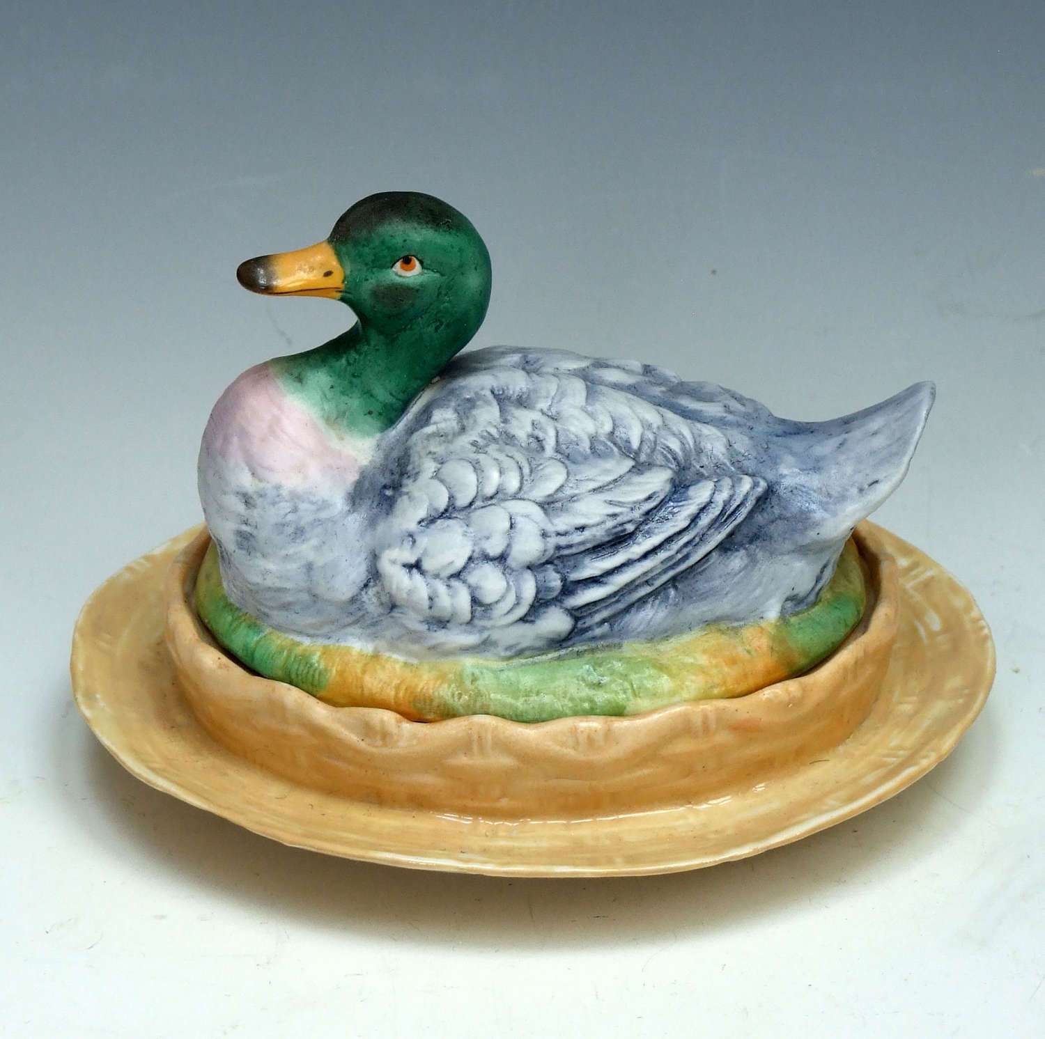 A charming and unusual painted bisque duck motif tureen.
