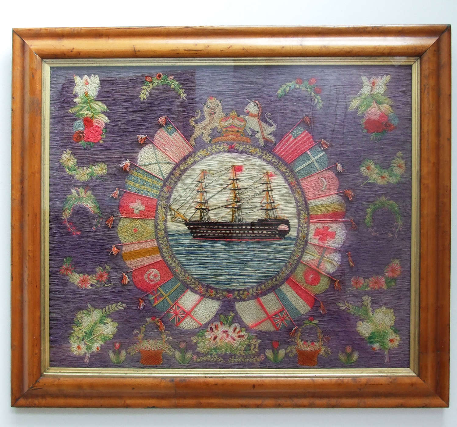 Colourful sailor's woolwork portrait of a Royal Navy ship of the line.