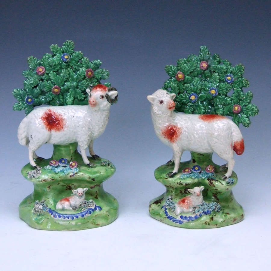 A rare pair of early 19thC pearlware Staffordshire sheep figures.