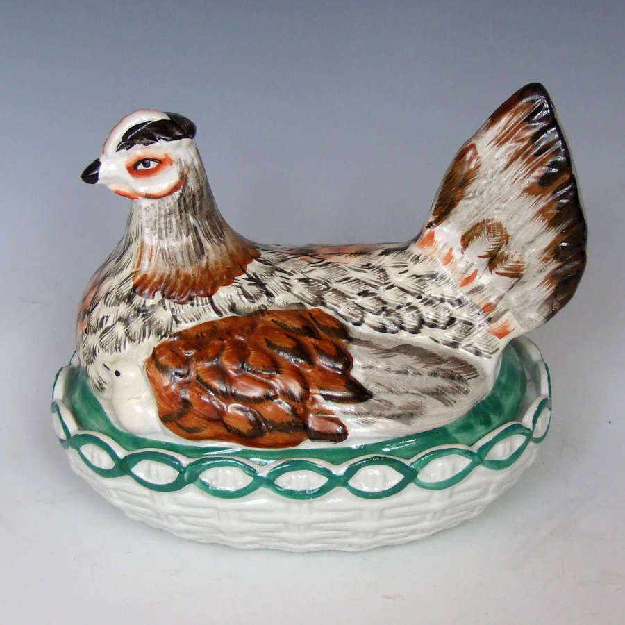 Staffordshire hen tureen with peeping chicks in unusual colours.