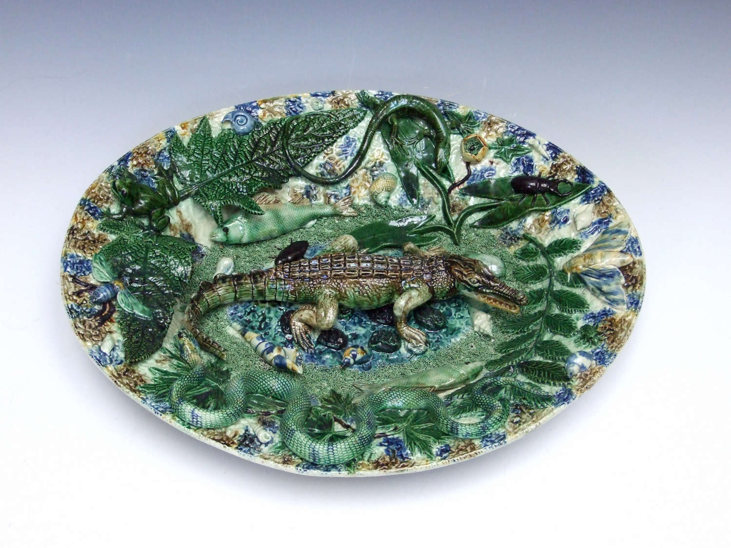 An extremely rare and impressive Palissy crocodile motif charger.