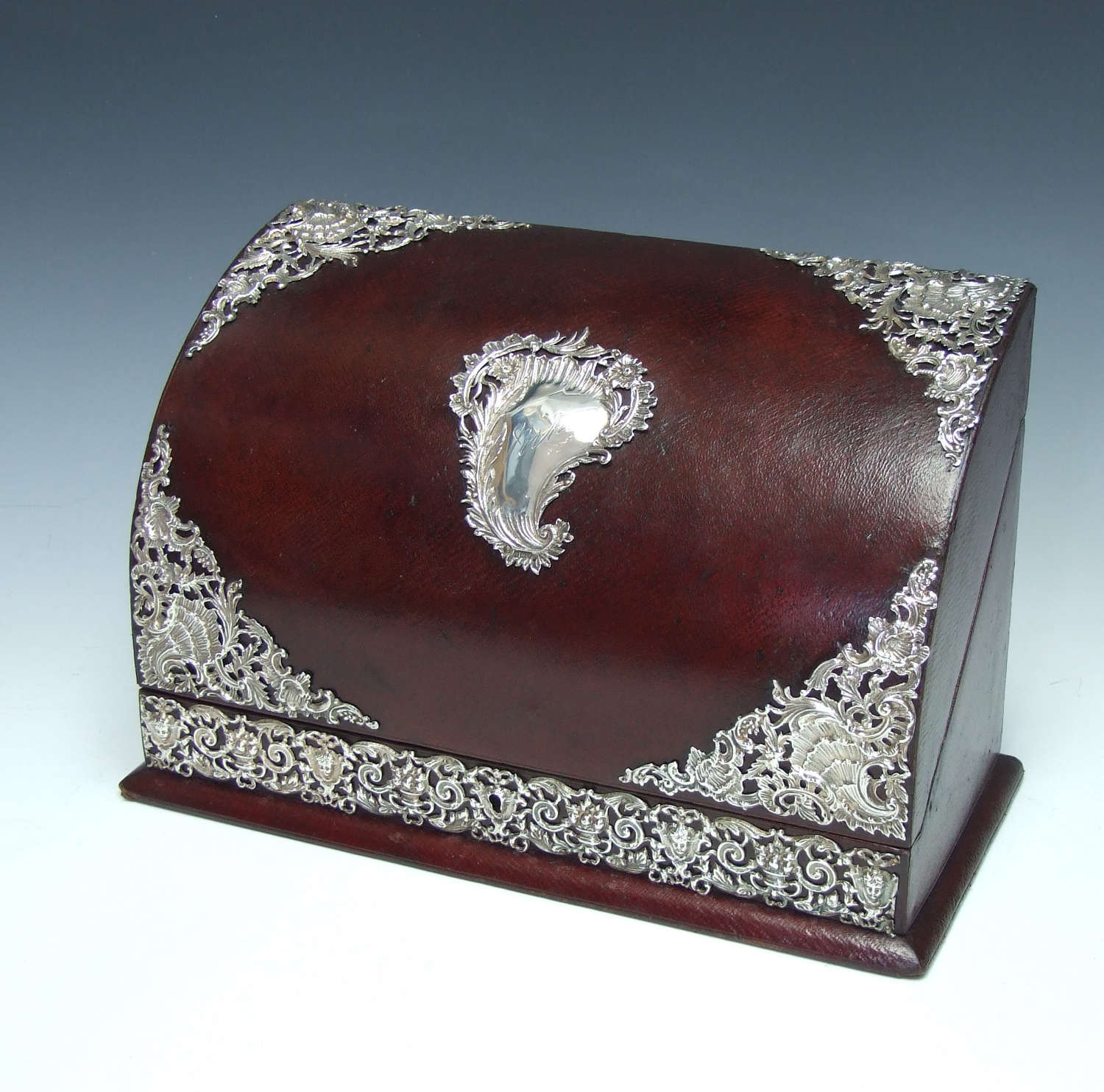 A lovely silver and leather domed stationery box.