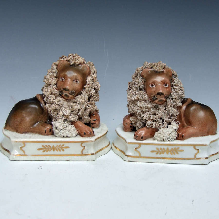 Charming and very rare pair of early Staffordshire Lion & Lamb figures