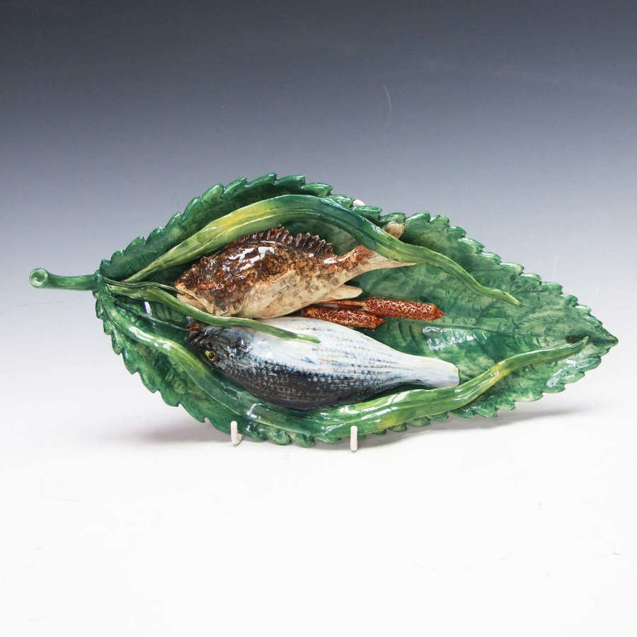 An extremely rare pair of Palissy Fish on leaf dishes by Battaglia