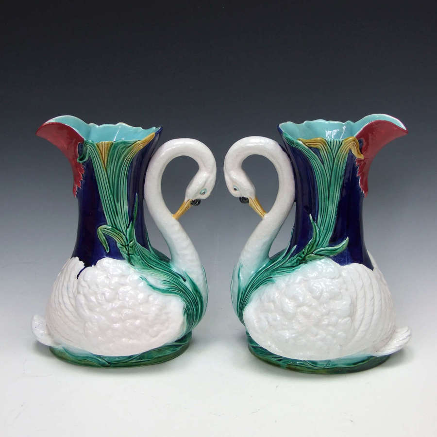 Very rare and unusual pair of Holdcroft majolica swan motif pitchers