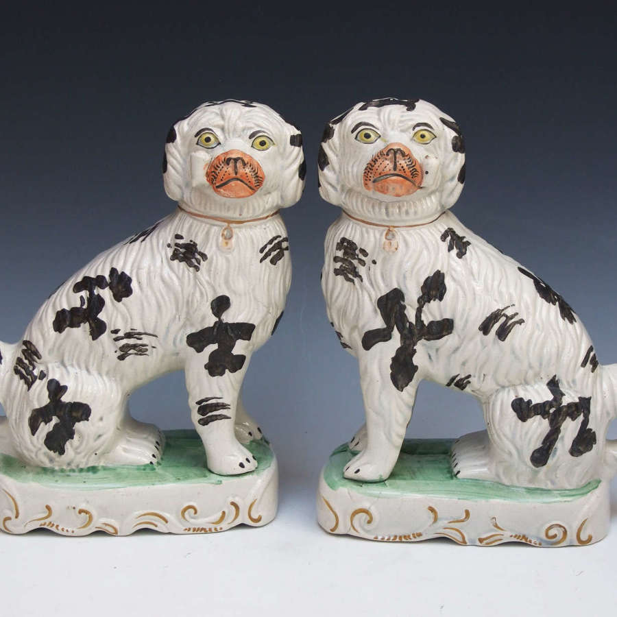 Exceptional pair of Staffordshire pipe smoking dogs