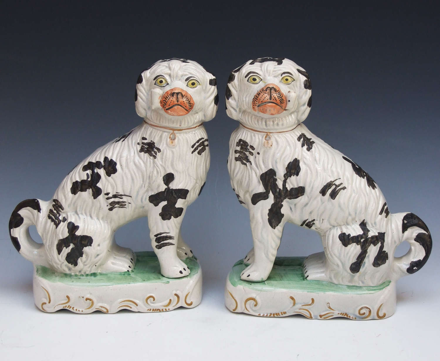 Exceptional pair of Staffordshire pipe smoking dogs