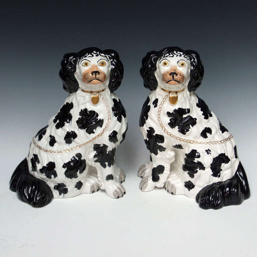 Superb pair of early large 'chubby' Staffordshire spaniel figures