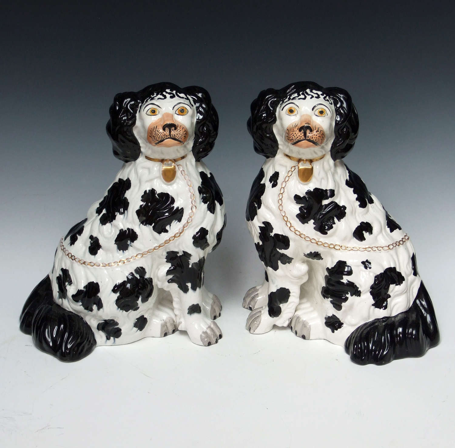 Superb pair of early large 'chubby' Staffordshire spaniel figures