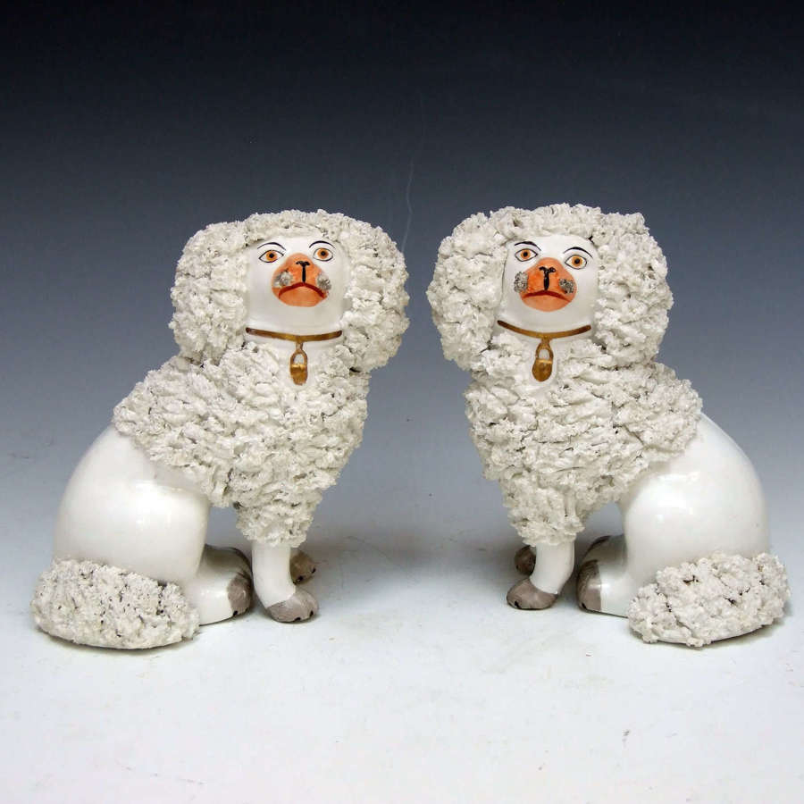 Fine pair of charming early Staffordshire figures of poodles
