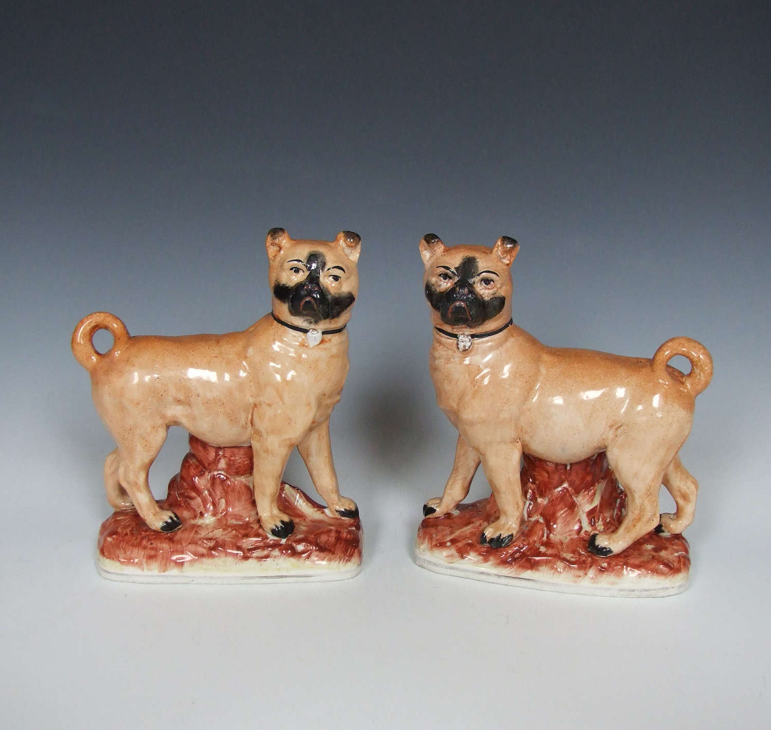 Rare pair of Staffordshire standing pug figures