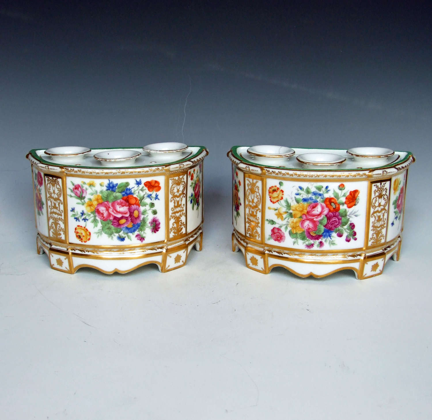 Exceptional pair of painted porcelain bough pots and covers