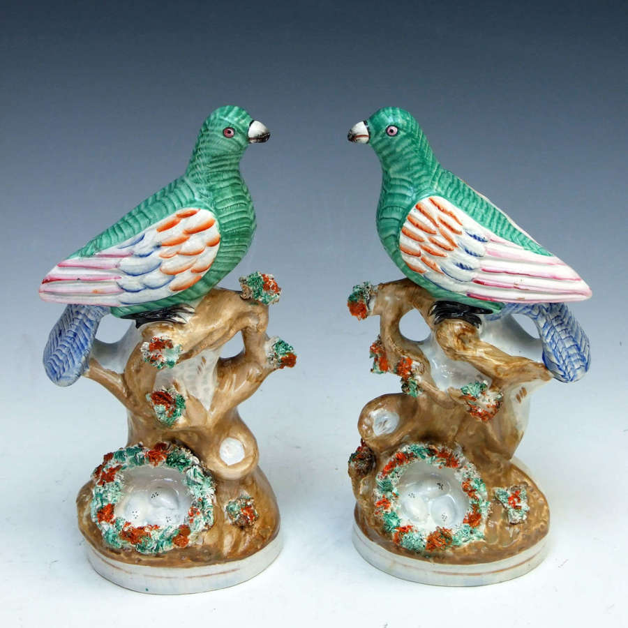 Beautiful and rare pair of Staffordshire bird and nest figures
